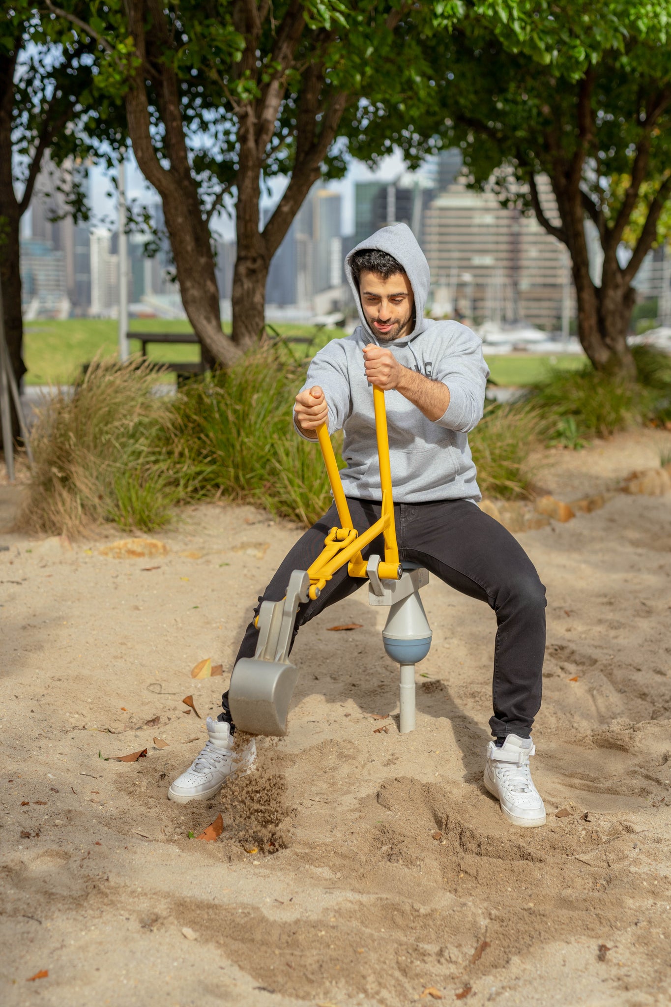 darren in sand pit wearing carbon grey classic thank-q hoodie